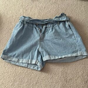 Light wash paperback denim shorts.